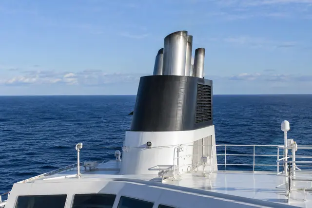 Illustrative ship funnel above an ocean-going vessel